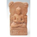 An antique 19th Century Indian terracotta buddha seated in the lotus position. The buddha having