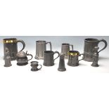 An excellent collection of 18th and 19th Century pewter tankards and pewter pepperette. measures
