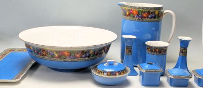 An early 20th century Wilkinson Ltd washbowl and jug together with a matching dressing table set