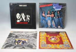 A group of four vinyl long play record albums by Thin Lizzy to include a – – Original Vertigo U.K.