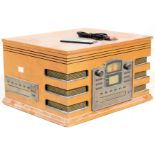 A vintage retro wooden effect Hi Fi stereo system by Steepletone with a black grill and facia.