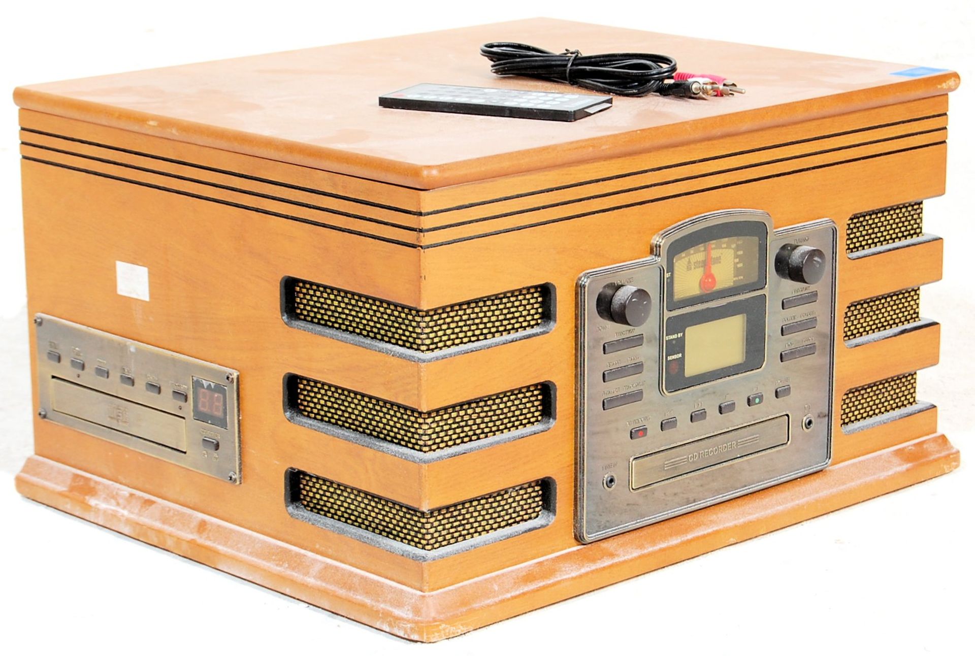 A vintage retro wooden effect Hi Fi stereo system by Steepletone with a black grill and facia.
