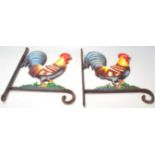 A pair of vintage 20th century cast iron cockerel / rooster wall mounted flower basket brackets.