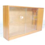 A vintage retro mid 20th Century low library bookcase  cabinet  in the manner of Herbert Gibbs