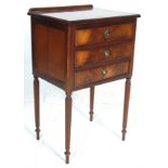 A 20th Century antique regency style flame mahogany bedside table / cabinet having a stage gallery