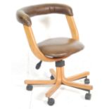 A contemporary modern design desk swivel chair of bentwood beech wood form. The chair having a