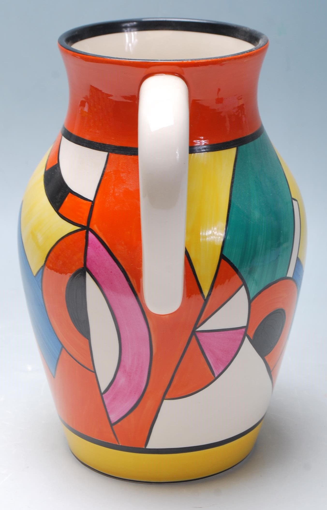 A Wedgwood Bizarre by Clarice Cliff Blue 'W' jug being hand painted with geometric decoration to the - Image 4 of 14
