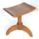 A 1920’s Arts & Crafts Cotswold school solid oak dressing table – country stool. The stool being