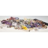 A large collection of Costume jewellery to include bracelets, rings, necklaces, brooches, scarf