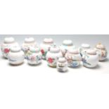 A collection of 20th Century Chinese republic period ginger jars decorated with famille rose