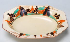 An early 20th Century Clarice Cliff dish of octagonal form in the " Tree and House " pattern