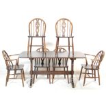 ERCOL - a retro vintage mid century dark beech and elm dining / refectory table and 6 chairs by