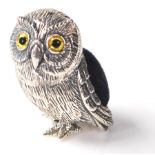 A sterling silver pin cushion in the form of an owl having a blue velvet cushion to the back.