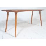 A retro vintage 20th Century, circa 1950s surfboard shaped teak wood coffee - occasional table.