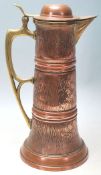 A large late 19th Century / early 20th Century German Art Nouveau copper and brass coffee pot by