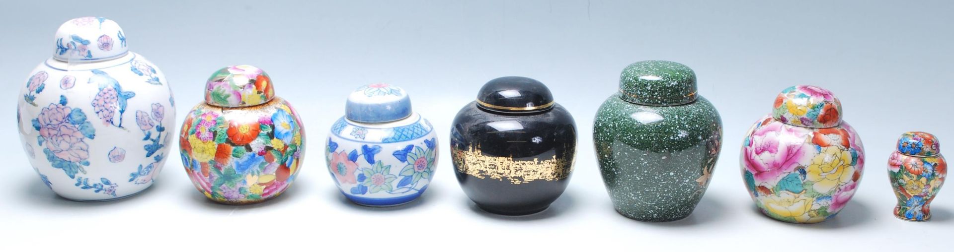 A group of 20th Century Chinese ginger jars of various styles to include blue and white floral