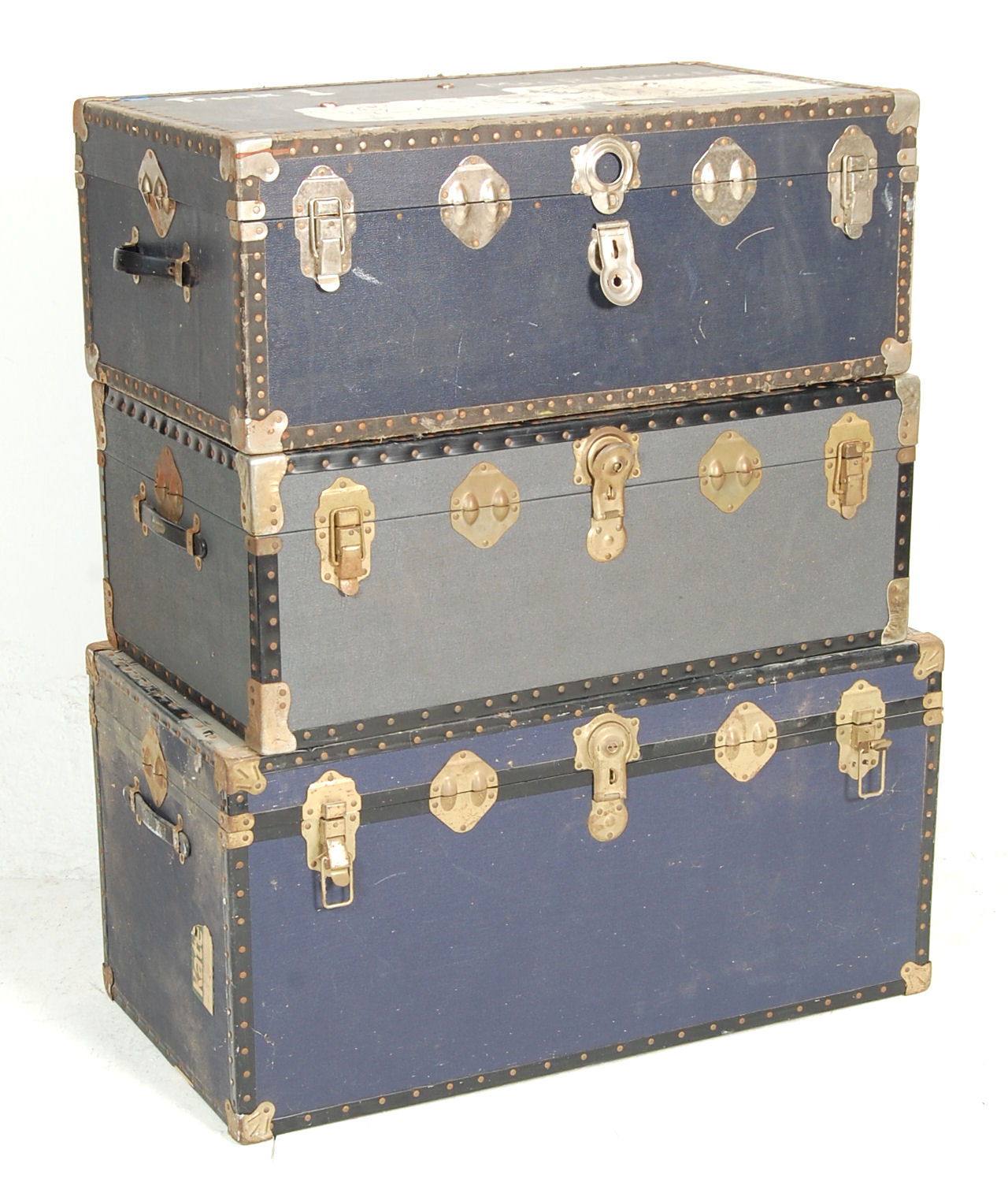 A collection of 3 vintage large early to mid 20th Century American canvas steamer / travel trunks.