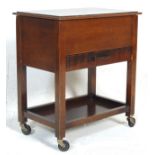 A 1920’s antique oak sewing box with hinged top and inlaid interior over a single drawer with soft
