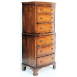 An early 20th century tallboy mahogany bow front chest on chest of drawers. The upright body