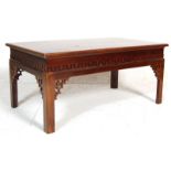 A 20th Century antique Chinese Opium style low coffee table of rectangular shape raised on four