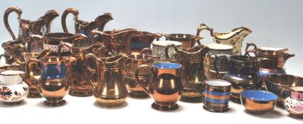 A large collection of 19th and 20th Century lustreware jugs to include a wide selection of shapes
