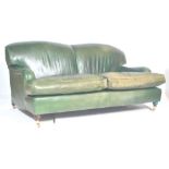 A good 20th century Howards of London type green full grain leather 2 seat sofa settee being