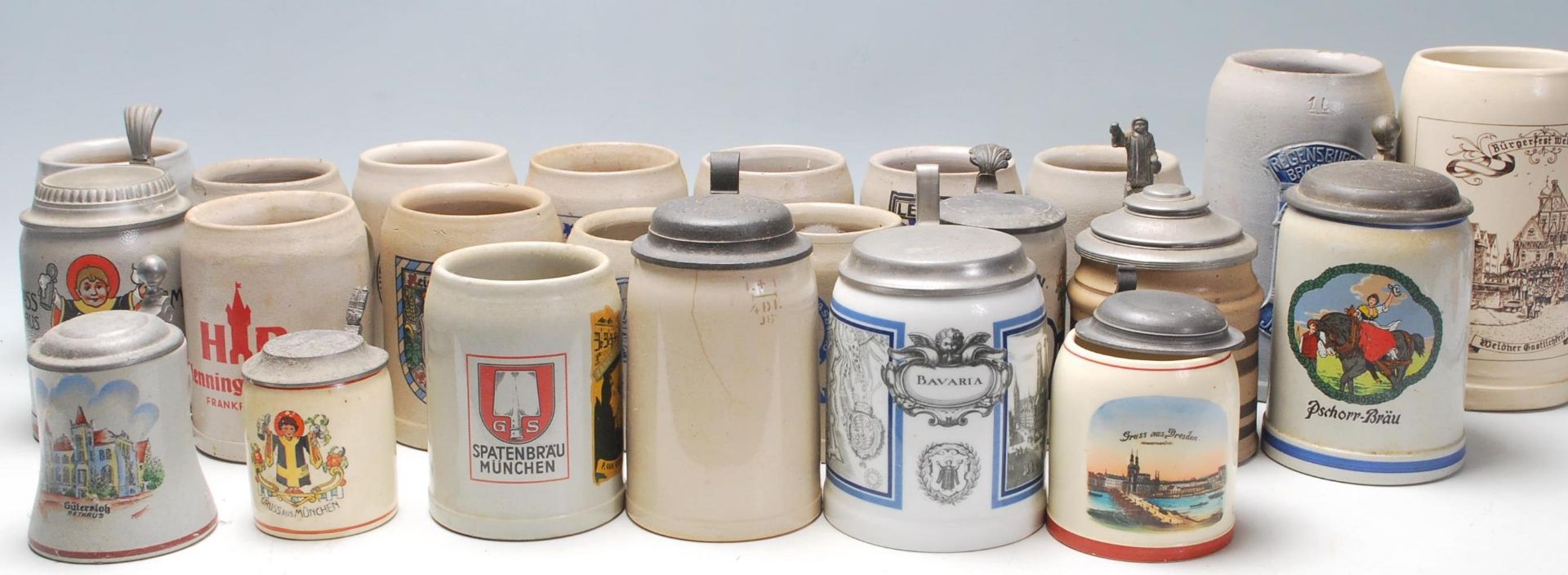 A large collection of 20th Century German blue and grey stoneware jugs and beer steins all having