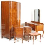 A 1930' Art Deco burr walnut bedroom suite consisting of double wardrobe with stepped doors having