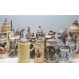 A collection of 20th Century German ceramic stein drinking glasses, each having raised polychrome