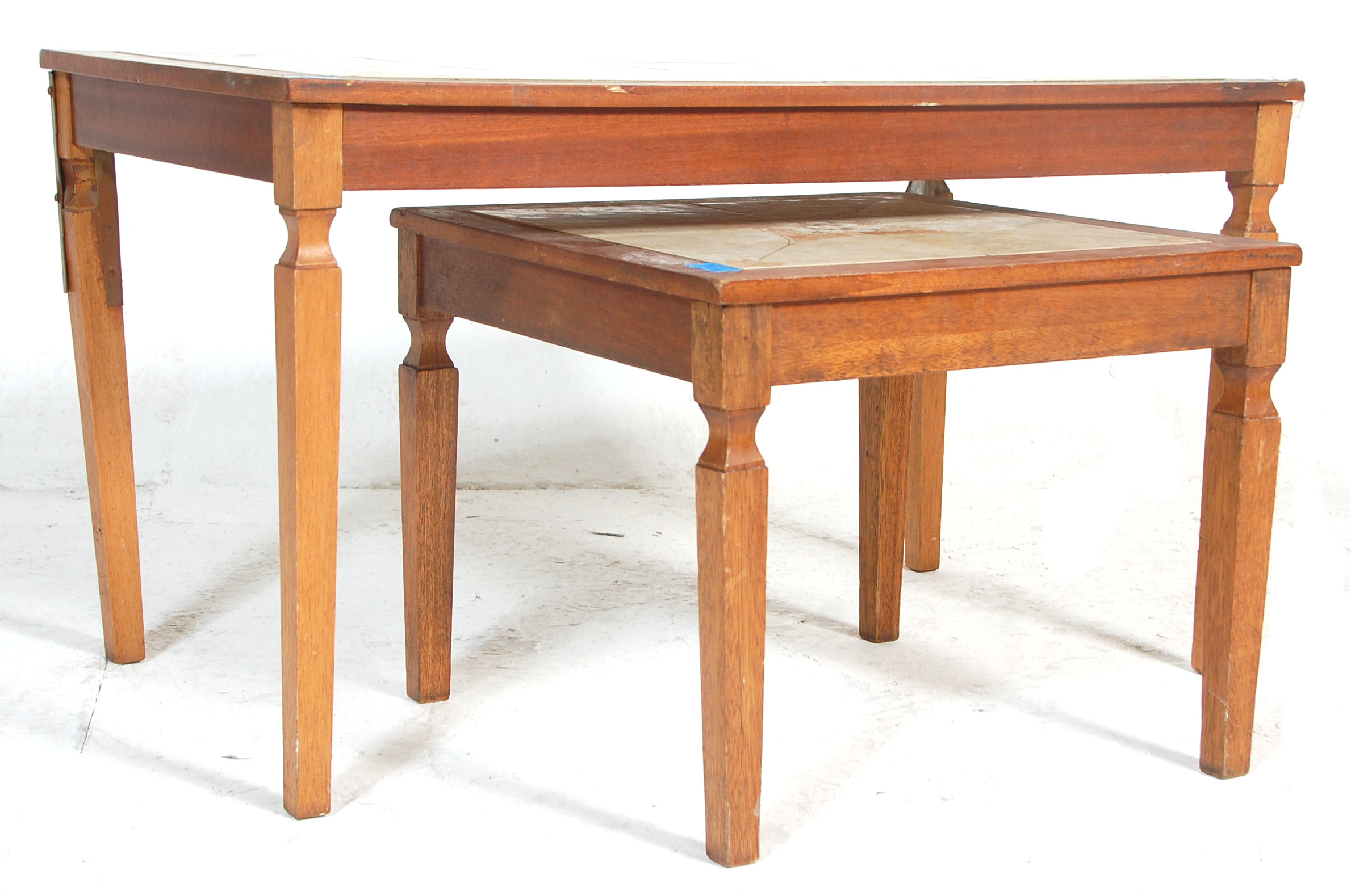 A pair of retro vintage 20th century teak wood and tile top coffee tables. Each featuring floral