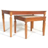A pair of retro vintage 20th century teak wood and tile top coffee tables. Each featuring floral