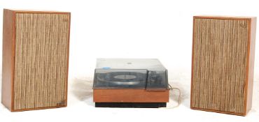 A vintage retro teak wood cased record player with a Garrard Transcription Model AP78 deck