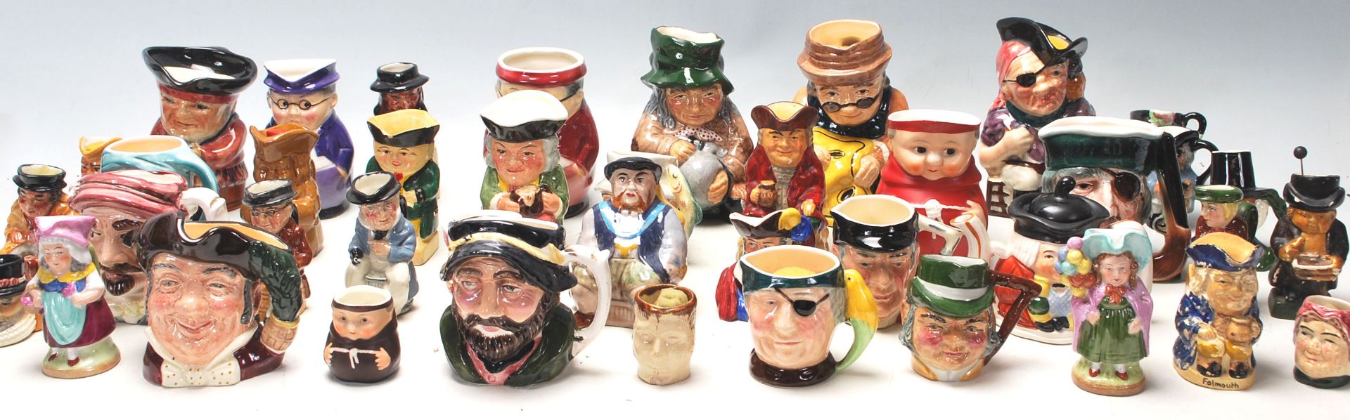 A large collection of miniature 20th Century character Toby Jugs to include, Sylvac, Royal