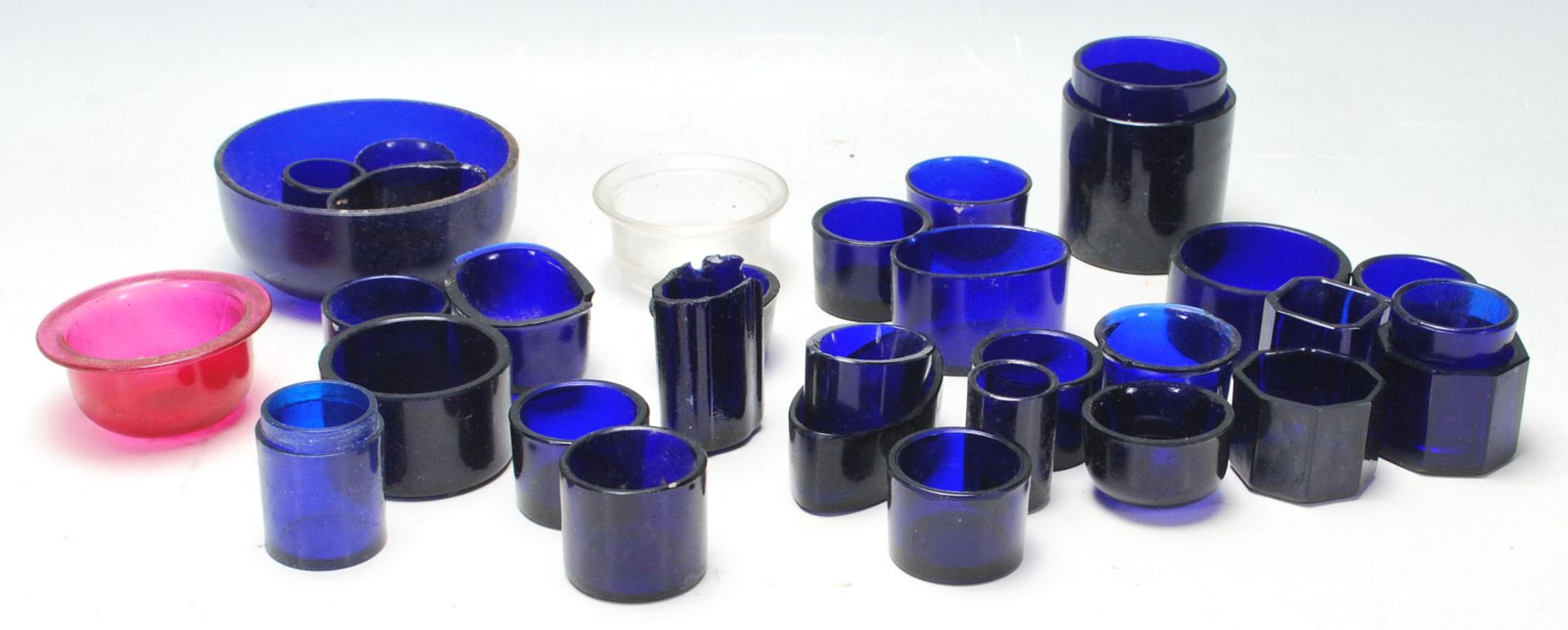 A good collection of 19th Century and later blue glass liners for condiments pots, to include