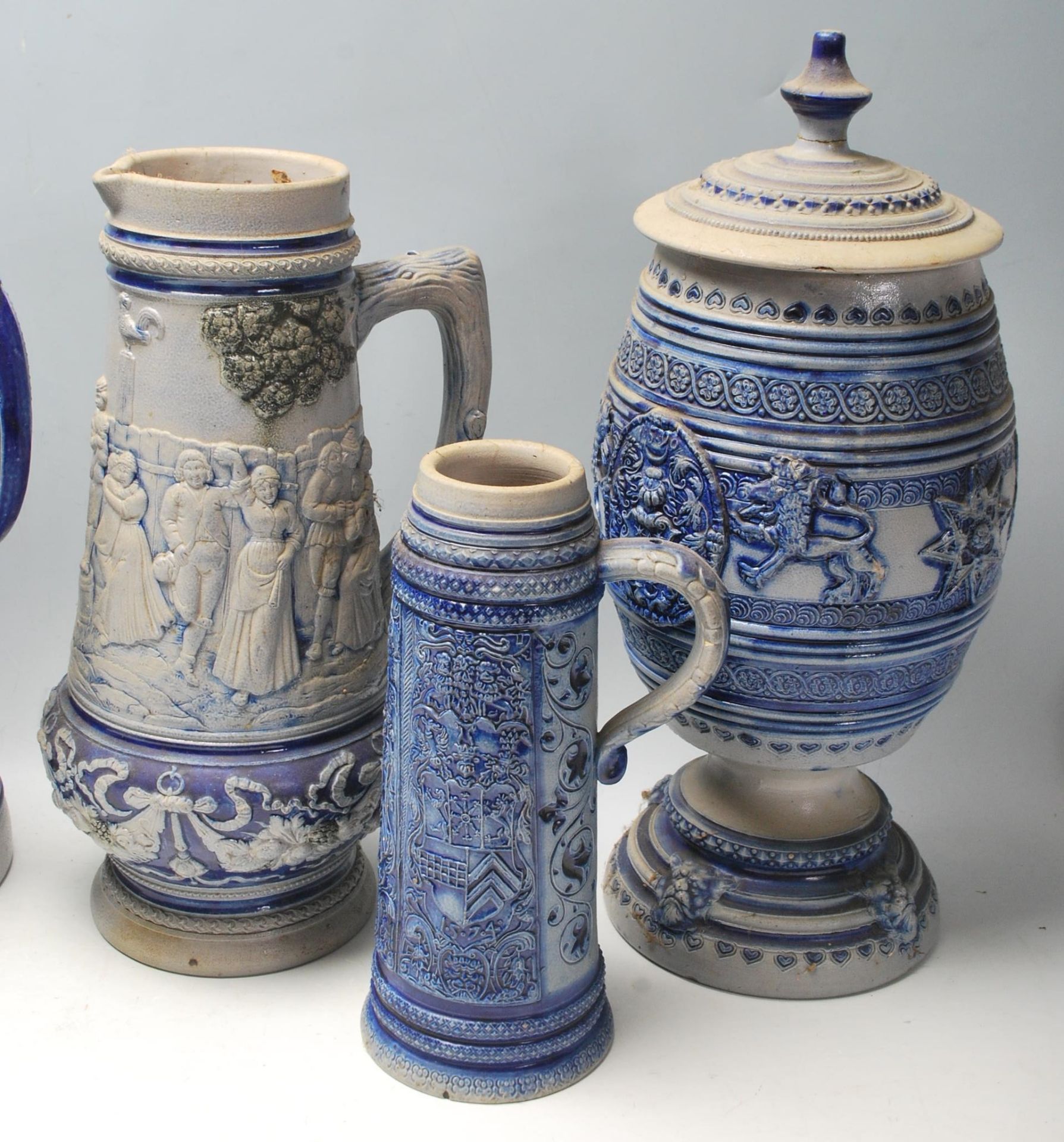 A collection of 20th Century German ceramic stein drinking glasses, each having raised decoration to - Bild 7 aus 7