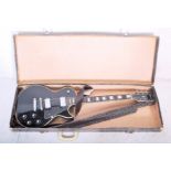 A vintage 20th Century Columbus Les Paul style electric guitar having a black body with four