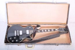 A vintage 20th Century Columbus Les Paul style electric guitar having a black body with four