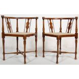 A pair of 19th Century Victorian mahogany corner chairs having horseshoe shaped arm rests and a