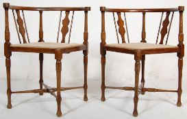 A pair of 19th Century Victorian mahogany corner chairs having horseshoe shaped arm rests and a