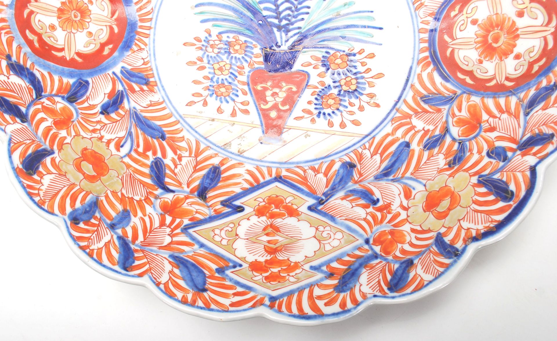 A 19th Century Japanese Imari charger plate with scalloped rim, typical decoration with a vase of - Image 4 of 6