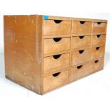 A vintage mid 20th Century haberdashery - shop dispaly  cabinet - chest of drawers. The chest having