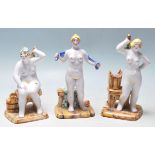 A group of three 20th Century ceramic Russian figurines depicting three stylised nudes ladies each
