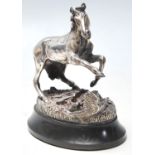 A hallmarked Sterling Silver figurine of a horse being startled by a bird set on a naturalistic