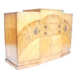 An early 1930’s Art Deco large walnut cocktail cabinet sideboard with central bank of drawers