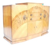 An early 1930’s Art Deco large walnut cocktail cabinet sideboard with central bank of drawers