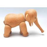A 1960’s Danish teak wood articulated elephant by Kay Bojesen, with an articulated trunk, black