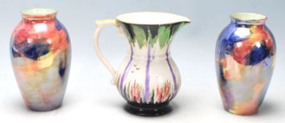 A group of early 20th Century 1930's ceramics to include a Green & Co jug being hand painted a