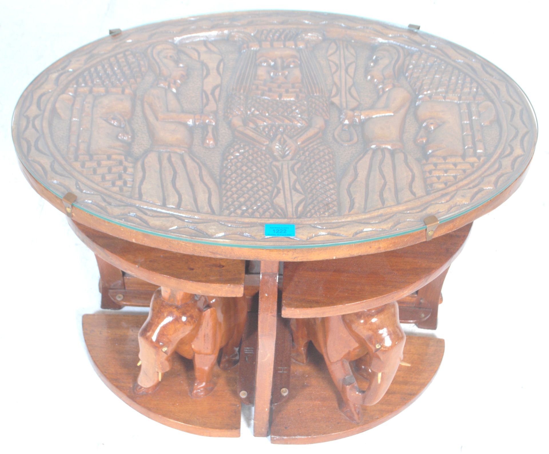A vintage 20th Century African tribal carved wooden nest of tables having a carved top depicting a - Bild 3 aus 7