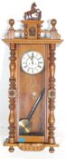 A 20th Century Vienna regulator wall clock in the manner of Gustav Becker having a mahogany glass