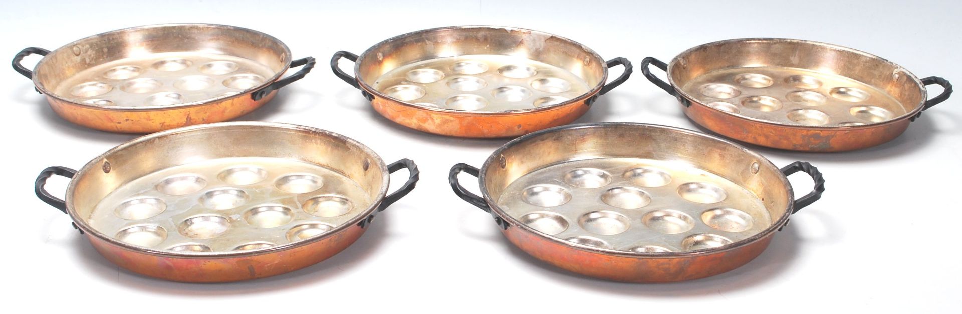 A good set of five vintage 20th Century SIGG Switzerland copper and iron snail / escargot pans,